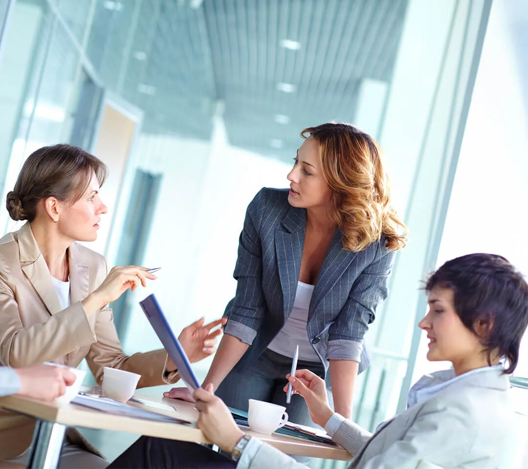 Three people in discussion during a meeting